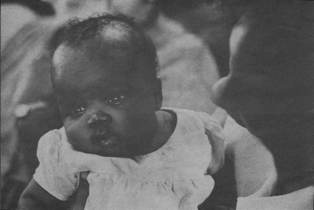 infant held under its arms